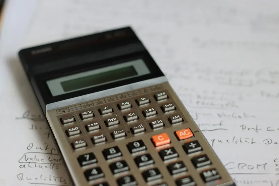 A pocket calculator on handwritten notes, for working out what an IPTV Free Trial plan costs per month